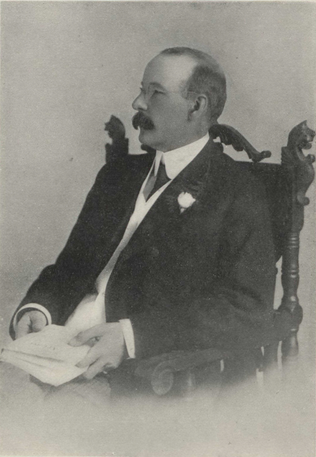 David R. Jack seated in chair