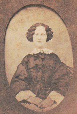 Sepia image of Lizzie Palmer, seated