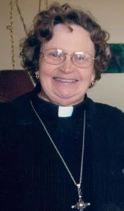 Headshot of Constance Soulikias wearing a clerical collar