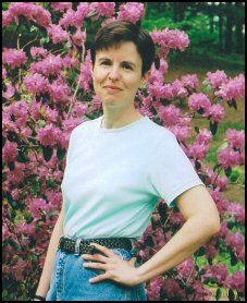 Darlene Ryan in front of pink azalea bush