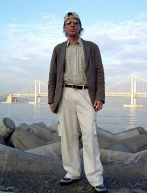 Vernon Mooers standing in front of bridge