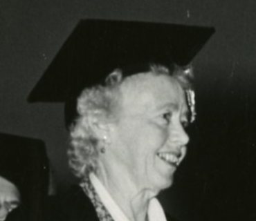 Headshot of Grace Avard Tomkinson wearing mortar board