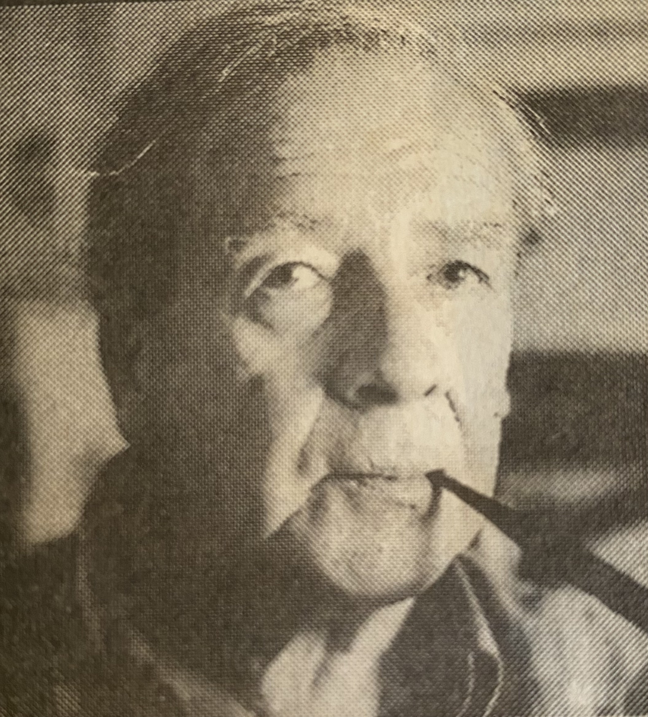 Headshot of B.J. Grant smoking a pipe